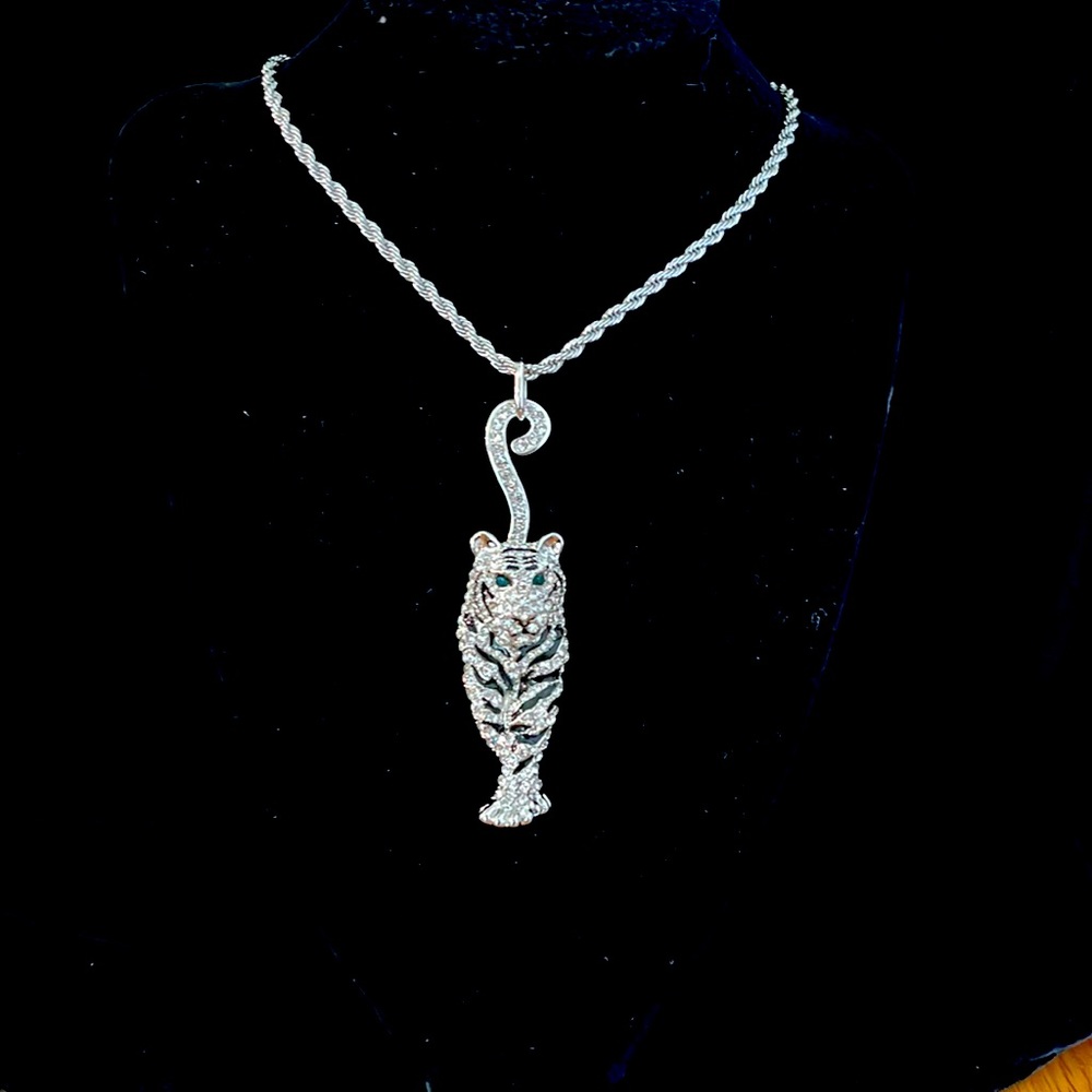 Black enamel and white crystal silver tone tiger necklace.